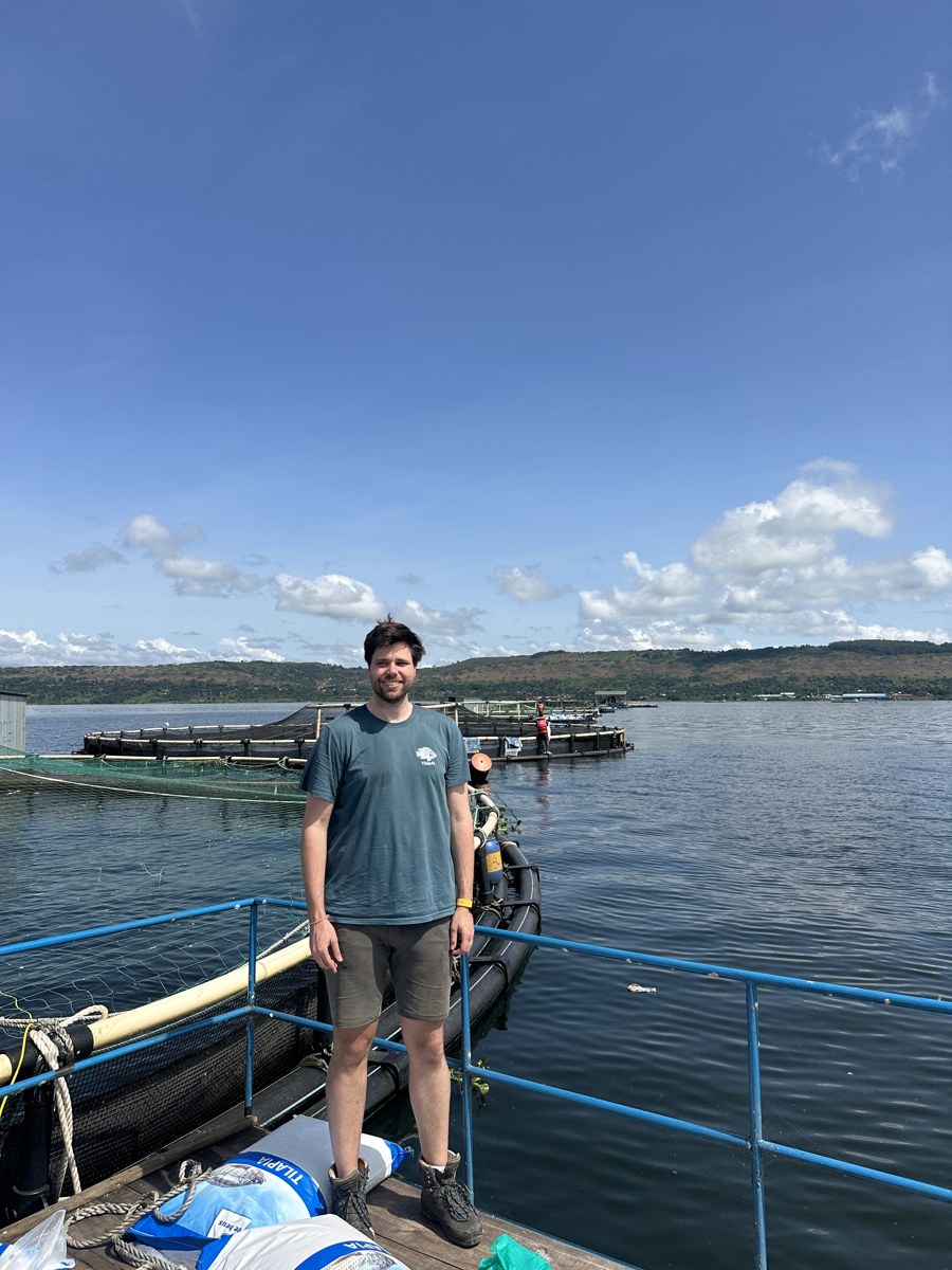 Floris van Rijn on a tilapia farm on Lake Victoria, wearing a TilapAI shirt